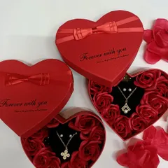 A perfect Valentine's Day or anniversary gift. This heart-shaped box is filled with artificial roses and contains a beautiful necklace and earring set.
