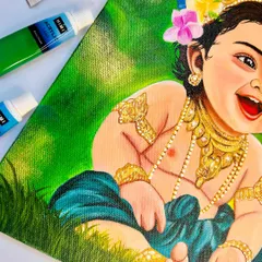 A detailed shot of the Bal Krishna painting, showing the texture of the canvas and the fine brushwork on his jewelry and clothing. Each element is painted with care to bring the piece to life.