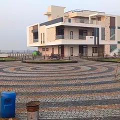 Here is a large driveway I completed using a circular pattern of multi-colored cobblestones. This shows the scale of projects I can supply materials for, creating a grand entrance for a modern home.