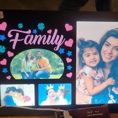 Celebrate your bond with a "Family" themed LED collage frame. It has space for multiple photos and features colorful, illuminated text and graphics.