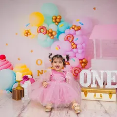 A full, happy smile that says it all. My goal is to create a fun atmosphere where kids can be themselves, resulting in genuine expressions like this.