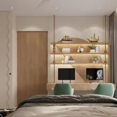 Across from the bed, we designed a custom twin-desk study zone with golden-lit shelves. The space is crafted to grow with the child, merging function and flair with details like wavy wardrobe doors.