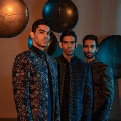 A trio of modern ensembles in shades of blue and black. Each jacket showcases a unique pattern and texture, from floral motifs to geometric embroidery, representing the diversity of our Indo-Western collection.