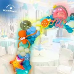 An ocean of fun. This underwater-themed balloon arch is perfect for a kid's party, featuring cute octopus and jellyfish balloon sculptures, starfish, and a variety of blue and white balloons to create a bubbly sea effect.