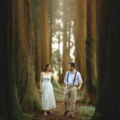 Walking together through a cathedral of ancient trees, their path lit by soft, filtered sunlight. This is the essence of my enchanted forest sessions, creating timeless, romantic portraits that feel intimate and grand all at once.