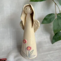 This angel figurine, with its simple form and hand-painted flowers, is part of my Yuletide Collection. It's a sweet and subtle piece of holiday decor.