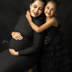 Welcoming a new baby is a journey for the whole family. This maternity portrait captures the sweet anticipation and the special bond between a mother and her first child before the new arrival.