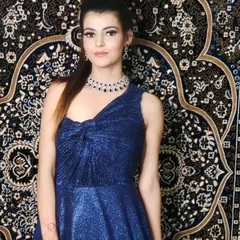This shimmering blue gown is accessorized with a beautiful American Diamond necklace set. The design is modern and chic, perfect for an evening event.
