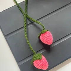 Cute crochet strawberry bag charms. These little accessories are a fun way to add a pop of color and personality to your favorite tote bag or backpack.