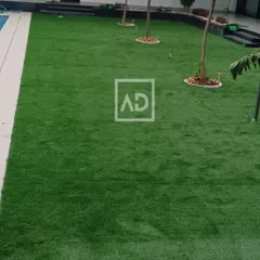 This large poolside area was fitted with my artificial grass, providing a lush, comfortable, and mud-free surface that stays green year-round, perfect for high-use family spaces.