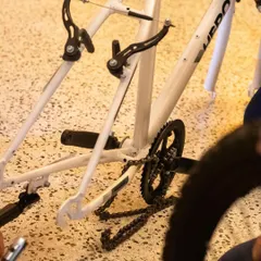 Here you can see the bicycle frame stripped down, with the chain and brake assembly exposed. This is what it looks like when we break things down to their fundamental parts to understand them.
