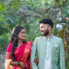 The couple takes a romantic stroll during their engagement photoshoot. These walking shots create a sense of movement and natural interaction.