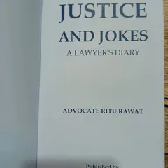 A close-up of the book "Justice and Jokes" by Advocate Ritu Rawat. A must-read for anyone interested in the legal profession.