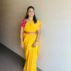 A full-length view of my self-makeover. The makeup is kept fresh and minimal to let the vibrant saree and traditional jewelry shine.