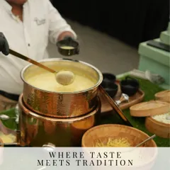 A close up of a rich, creamy soup being served in a traditional copper pot. This dish represents our commitment to combining authentic taste with traditional serving ware for a complete sensory experience.