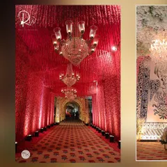 A breathtaking entrance tunnel for a sangeet night, with walls and ceiling covered in thousands of red carnations and illuminated by grand crystal chandeliers. It created an immersive and luxurious experience.