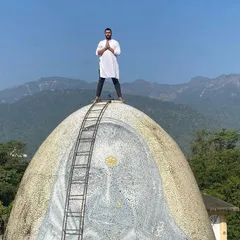 On top of the world, or at least on top of one of the domes at the Beatles Ashram. A moment of peace and gratitude.