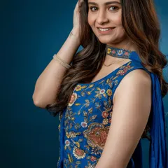 A close-up on the intricate, multi-colored embroidery that makes this Indo-Western piece a true statement outfit.