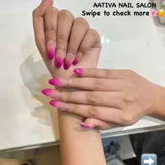 Another look at our eye-catching hot pink ombré nails, a favorite for clients who love a pop of color.