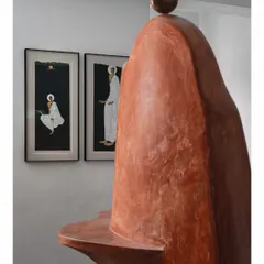 The "Melting Candle" wall serves as a sculptural backdrop for other art pieces. Here, it stands behind two beautiful paintings, creating a rich dialogue between different forms of art. It is a prime example of how we layer artistic elements to tell a deeper story.