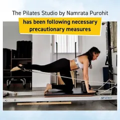 A client performs a single-leg kickback on the Reformer, an excellent exercise for targeting the glutes and hamstrings while stabilizing the core. This demonstrates the precision and control that are central to my Pilates method.
