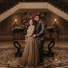 A regal portrait of Madhushree and her husband at their reception. Her makeup is elegant and timeless, with a soft glam eye and a flawless complexion that radiates sophistication.