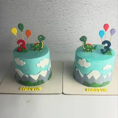 Double the trouble, double the fun! These identical dinosaur-themed cakes were for a set of twins turning three. One was Vanilla Blueberry and the other Vanilla Caramel.