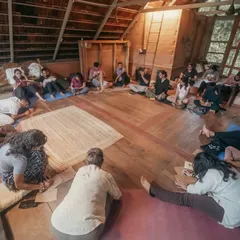 Here, a group gathers in a sharing circle, a sacred space for honest connection and heartfelt conversation. These circles are central to my retreats, offering a judgment-free zone to be seen, heard, and supported by the community.