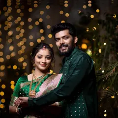 A lovely portrait of the happy couple smiling for the camera during their engagement ceremony.