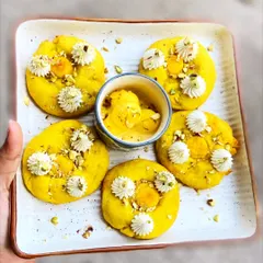 Our Rasmalai Cookies are a unique fusion treat. We combine the texture of a soft cookie with the classic flavors of rasmalai, including saffron and pistachio, for a truly special bite.