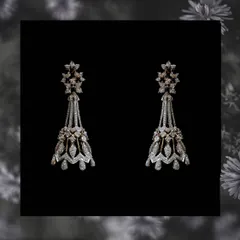 These long statement earrings are crafted in an intricate chandelier design with multiple tiers of diamonds. They are perfect for adding a touch of glamour to an evening gown or a traditional outfit.
