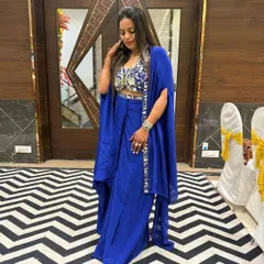 Another shot of the client confidently rocking the royal blue cape set.