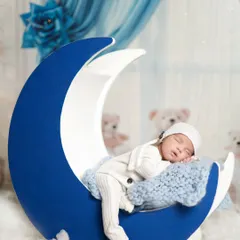 Sleeping on the moon. This is one of our favorite poses for newborns, creating a dreamy and magical portrait. This entire setup was done in our client's home.