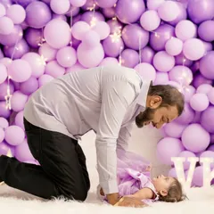 A tender moment between a father and his baby girl. These candid interactions are what make family photoshoots so special.
