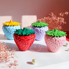 My hand-painted strawberry trinket jars are perfect for storing your little treasures. They have a high-gloss finish and are available in five fun colors.