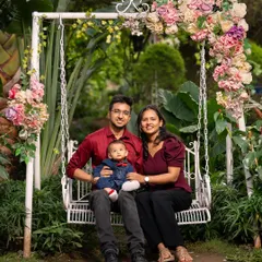 Creating a classic family portrait is about more than just posing. It's about finding a beautiful setting, like this floral swing, and creating a relaxed atmosphere where the family's natural connection can be felt. This is a timeless heirloom photo the family will cherish for years.