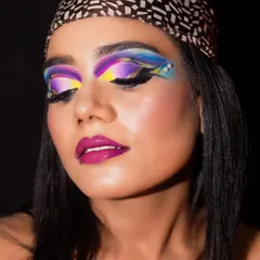 Another angle of the Brazilian gaze makeup, showing the intricate blending of purple, yellow, and blue. My fantasy makeup course focuses on mastering these advanced color techniques.