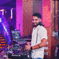 Here I am at the BOHO console, ready for another Desi Thursday. My setup includes a laptop for my audio-visual set, ensuring a dynamic experience.