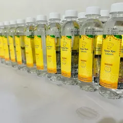 Our custom-branded water bottles, ready for an event. This small detail reflects our professional approach and commitment to providing a complete service.