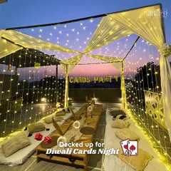 Decked up for a Diwali Cards Night. We transformed this terrace with a stunning canopy of fairy lights, creating a magical and festive atmosphere for a cozy sit-down party.