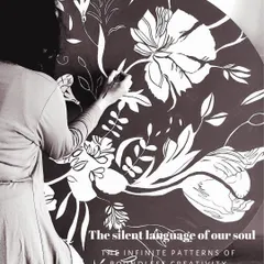 Working on a large, round canvas with a monochrome floral pattern. This piece explores the silent language of creativity through the infinite, intertwined patterns of nature, created with bold white on a dark background.