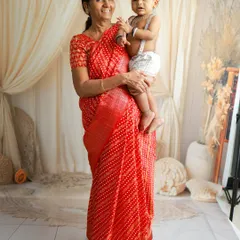 The bond between a grandmother and her grandchild is so precious. Here, she holds her grandbaby during a maternity session for her daughter, a beautiful multi-generational moment.