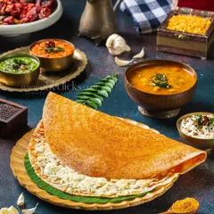 A crispy, golden cheese dosa, shot for a restaurant menu. The lighting is focused on making the cheese look melted and delicious, with traditional accompaniments in the background.