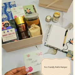 This eco-friendly Rakhi hamper combines tradition with a modern, sustainable touch. It includes sweet treats, a beautiful Rakhi, and a protective Evil Eye Roli Chawal set.