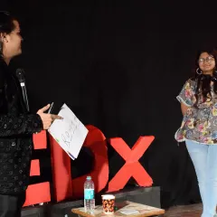 Here I am on the TEDx stage with a volunteer from the audience. My acts often involve audience participation because it's the best way to demonstrate the power of suggestion and psychology in real time.