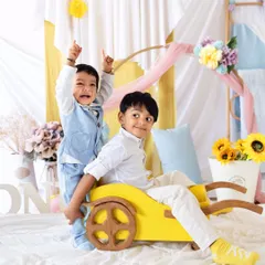 A glimpse from our Mother's Day mini sessions, featuring a mom and her two boys in a bright, cheerful setup. These minis are perfect for capturing updated family portraits.