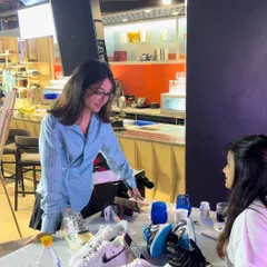 A guest discusses her design ideas with one of our artists at the live customization table. This one-on-one interaction is central to our service, ensuring each person gets a truly personal design.