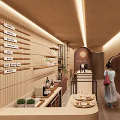 The service area at Sugar State, featuring a clean, minimalist menu board and fluted wood paneling. The design focuses on texture and form to elevate the customer experience.