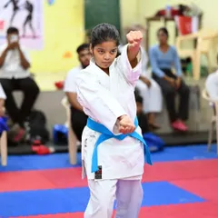 Executing a perfect block. This student shows the precision and power we teach in our Shito Ryu karate classes, preparing her for both kata and kumite.