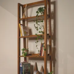 A full view of my handcrafted teak ladder bookshelf. This timeless piece blends durability with natural beauty, providing ample space for displaying your favorite books and treasures.